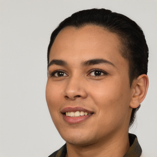 Joyful latino young-adult female with short  black hair and brown eyes