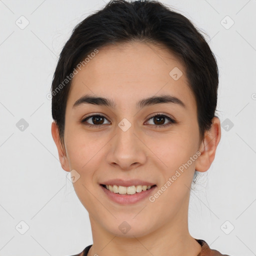 Joyful white young-adult female with short  brown hair and brown eyes