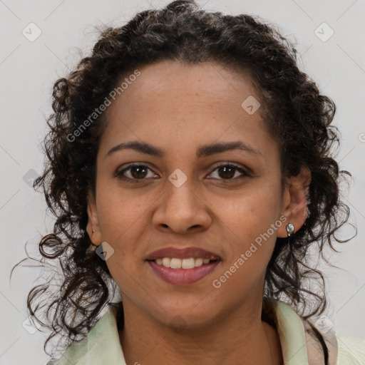 Joyful black young-adult female with long  brown hair and brown eyes