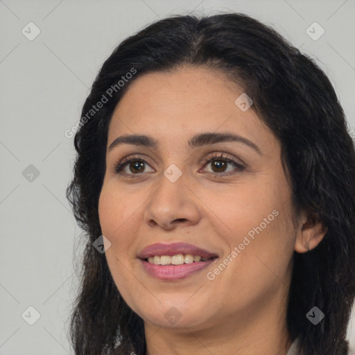 Joyful latino young-adult female with long  brown hair and brown eyes