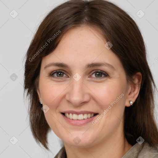 Joyful white adult female with medium  brown hair and brown eyes