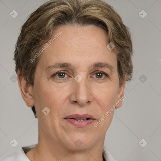 Joyful white adult female with short  brown hair and grey eyes