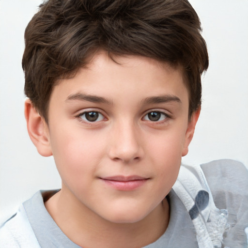 Joyful white child male with short  brown hair and brown eyes