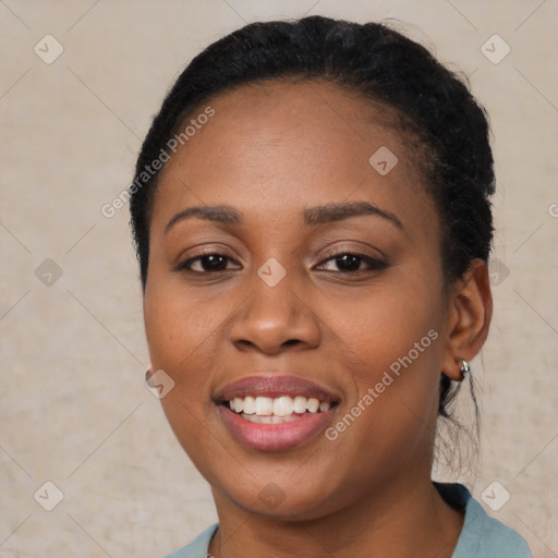 Joyful black young-adult female with short  brown hair and brown eyes