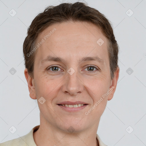 Joyful white adult female with short  brown hair and grey eyes