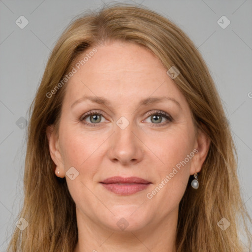 Joyful white adult female with long  brown hair and grey eyes