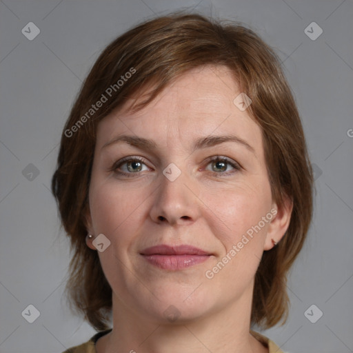 Joyful white adult female with medium  brown hair and grey eyes