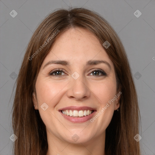 Joyful white young-adult female with long  brown hair and brown eyes