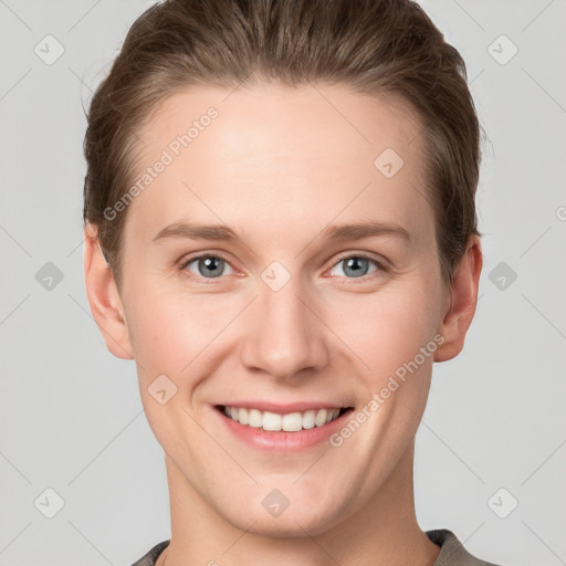 Joyful white young-adult female with short  brown hair and grey eyes