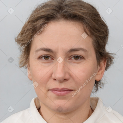 Joyful white adult female with short  brown hair and brown eyes