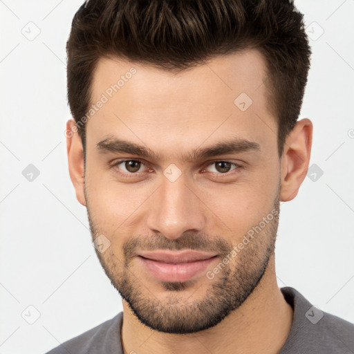 Joyful white young-adult male with short  brown hair and brown eyes