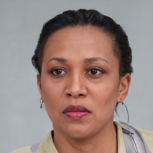 Neutral black adult female with short  black hair and brown eyes