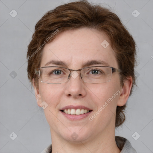 Joyful white adult female with short  brown hair and grey eyes