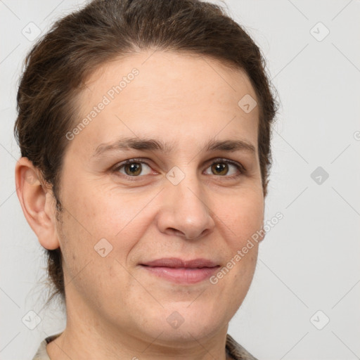 Joyful white adult female with short  brown hair and brown eyes