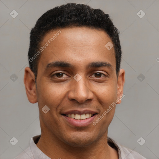 Joyful latino young-adult male with short  brown hair and brown eyes