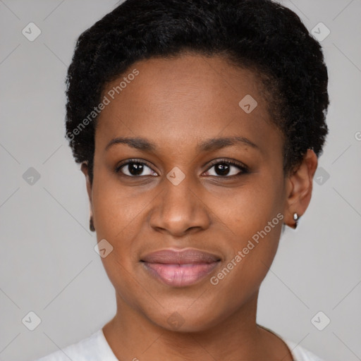 Joyful black young-adult female with short  black hair and brown eyes