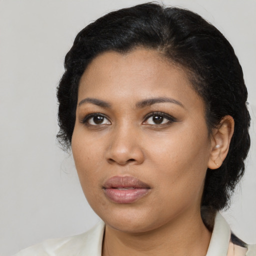 Joyful black young-adult female with medium  black hair and brown eyes