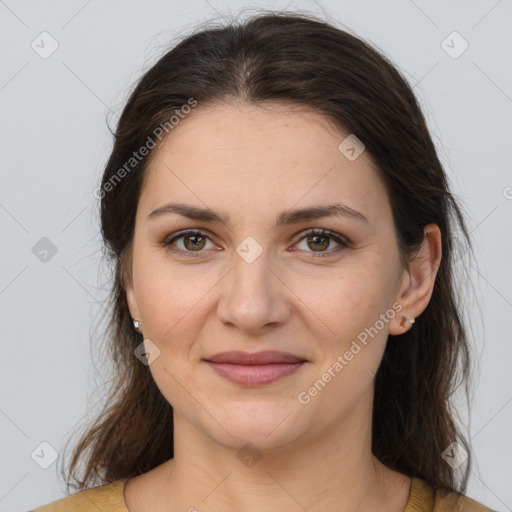 Joyful white young-adult female with medium  brown hair and brown eyes