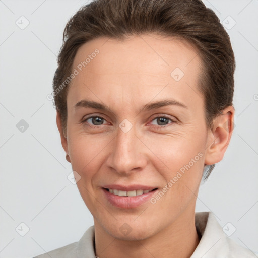 Joyful white adult female with short  brown hair and brown eyes