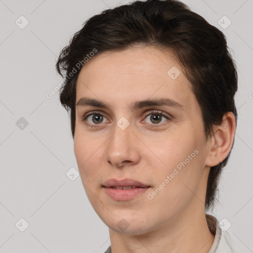 Joyful white young-adult female with medium  brown hair and brown eyes