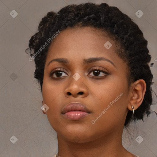 Neutral black young-adult female with medium  brown hair and brown eyes