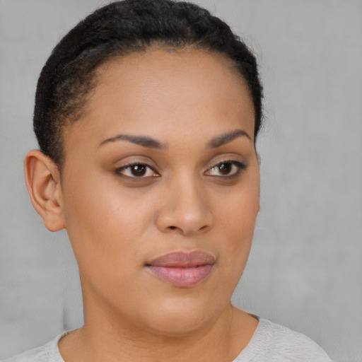 Joyful latino young-adult female with short  brown hair and brown eyes
