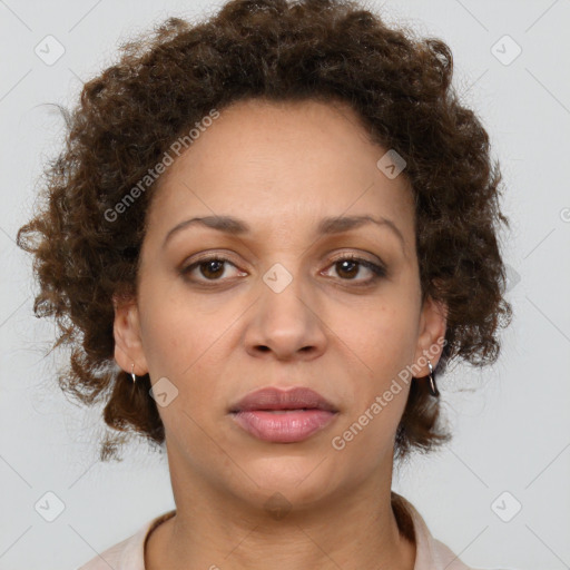 Joyful black adult female with medium  brown hair and brown eyes