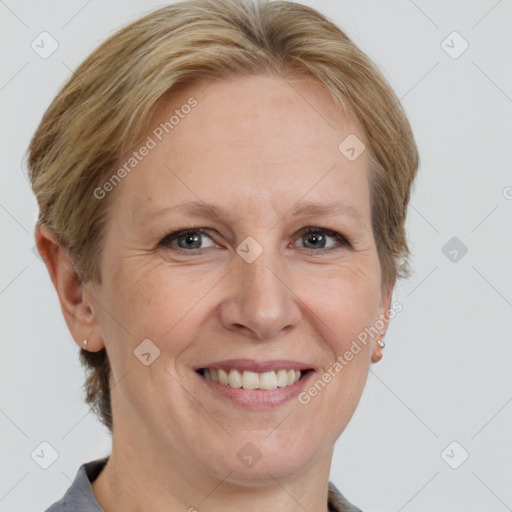 Joyful white adult female with medium  brown hair and grey eyes