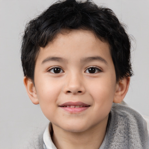 Joyful white child male with short  brown hair and brown eyes