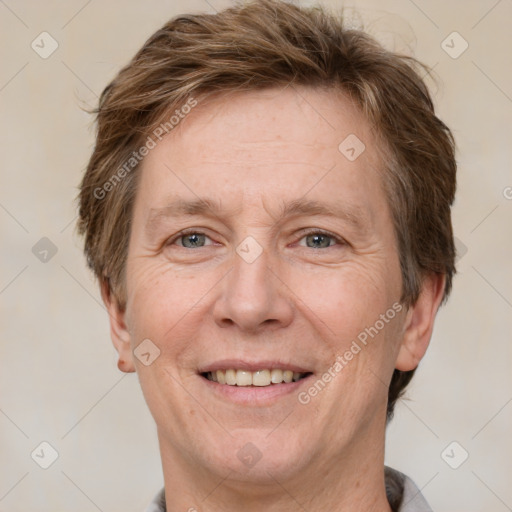 Joyful white adult male with short  brown hair and grey eyes