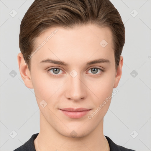 Joyful white young-adult female with short  brown hair and grey eyes