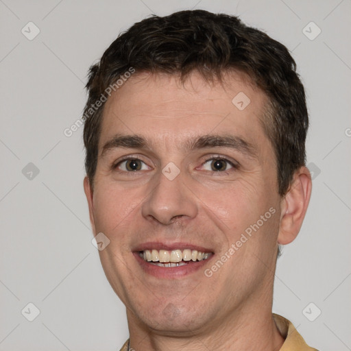 Joyful white young-adult male with short  brown hair and brown eyes