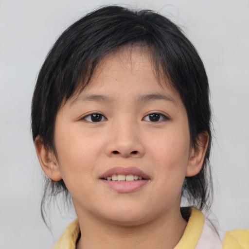 Joyful asian child female with medium  brown hair and brown eyes