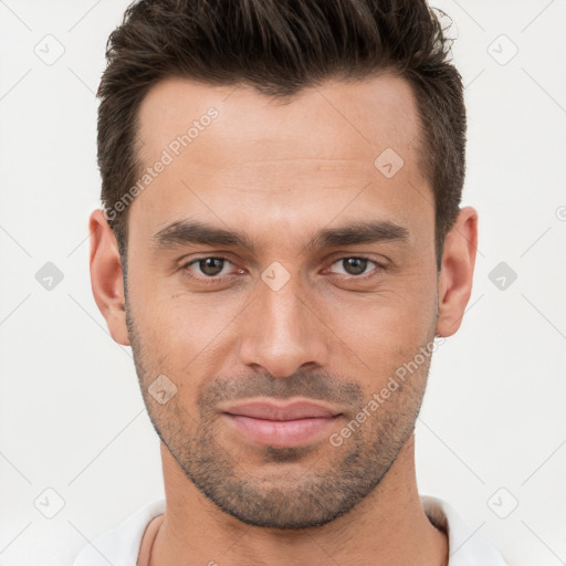 Joyful white young-adult male with short  brown hair and brown eyes