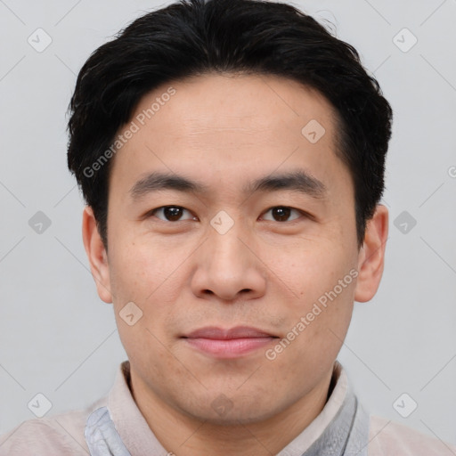 Joyful asian young-adult male with short  black hair and brown eyes