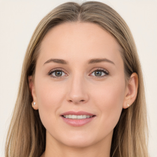 Joyful white young-adult female with long  brown hair and grey eyes