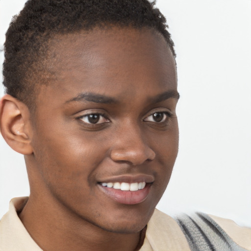 Joyful black young-adult male with short  brown hair and brown eyes