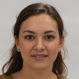 Joyful white young-adult female with medium  brown hair and brown eyes