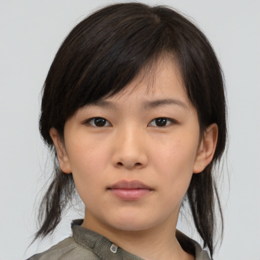Neutral asian young-adult female with medium  brown hair and brown eyes