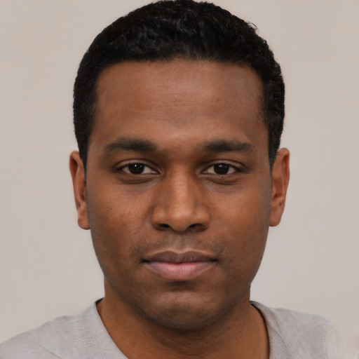 Neutral black young-adult male with short  black hair and brown eyes
