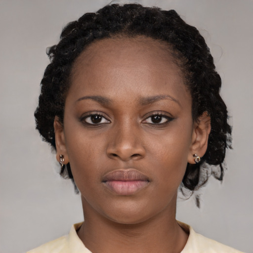 Neutral black young-adult female with short  brown hair and brown eyes