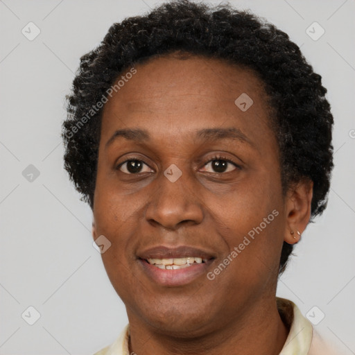 Joyful black adult female with short  brown hair and brown eyes