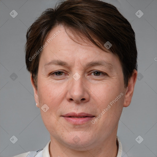 Joyful white adult female with short  brown hair and brown eyes