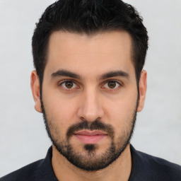 Neutral white young-adult male with short  black hair and brown eyes