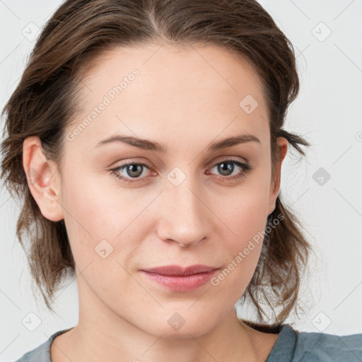 Joyful white young-adult female with medium  brown hair and blue eyes