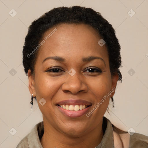 Joyful black adult female with short  brown hair and brown eyes