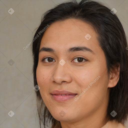 Joyful asian young-adult female with medium  brown hair and brown eyes