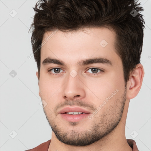 Neutral white young-adult male with short  brown hair and brown eyes