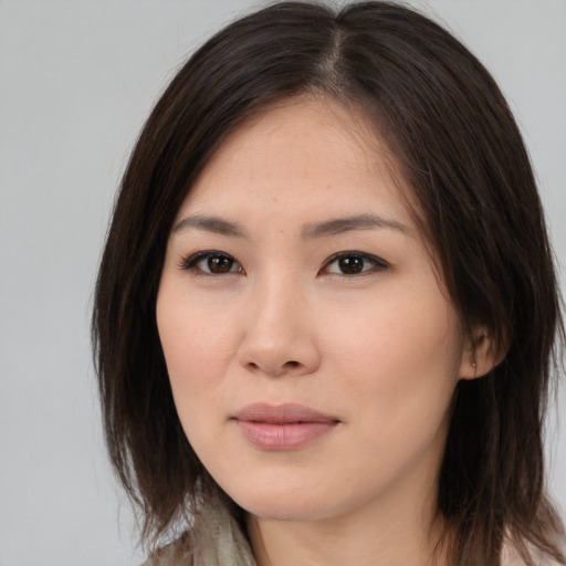 Neutral asian young-adult female with medium  brown hair and brown eyes