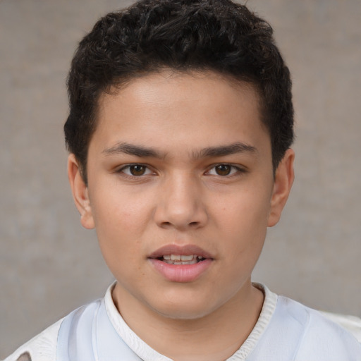 Joyful white child male with short  brown hair and brown eyes
